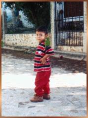 Boy with bird on shoulder