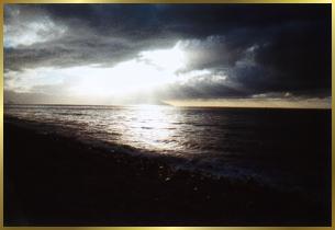 Sun streaking through clouds over Banderas Bay.
